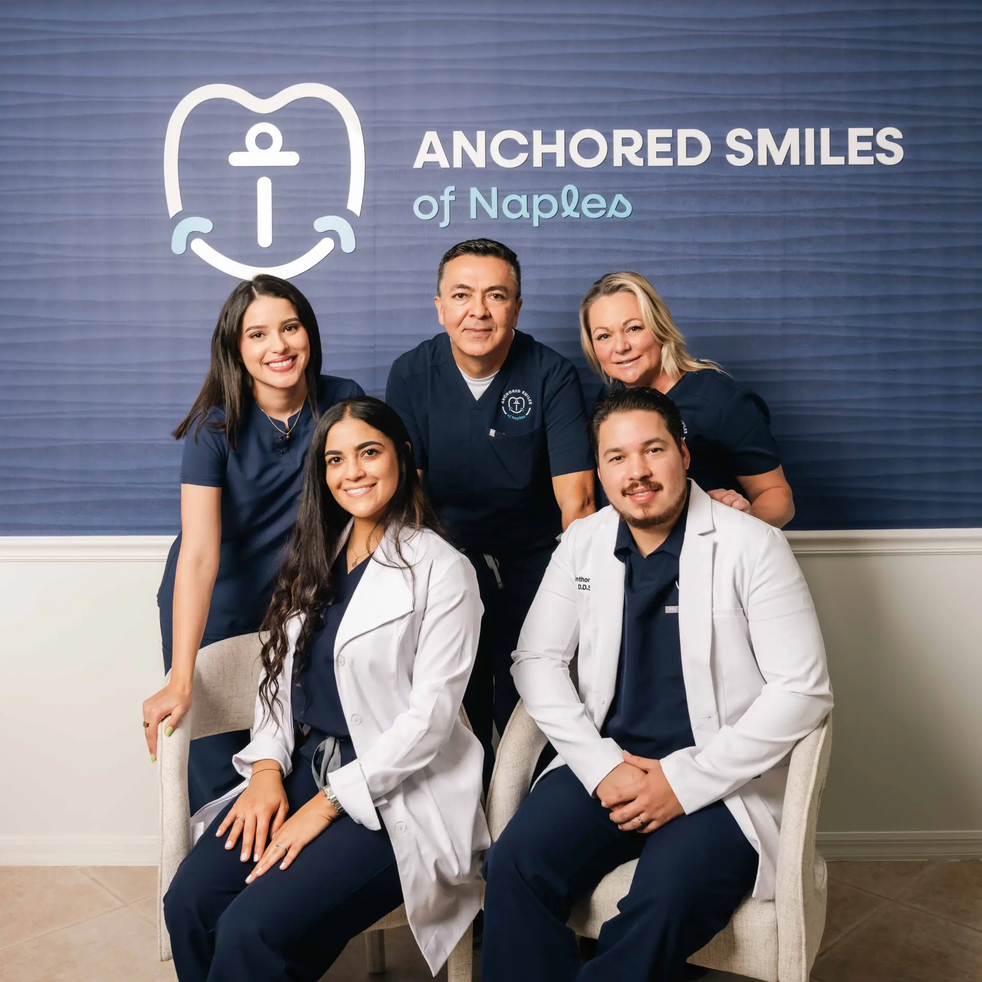 Dr. Nicole Ricart and Dr. Kenninthon Muñoz with the Anchored Smiles team